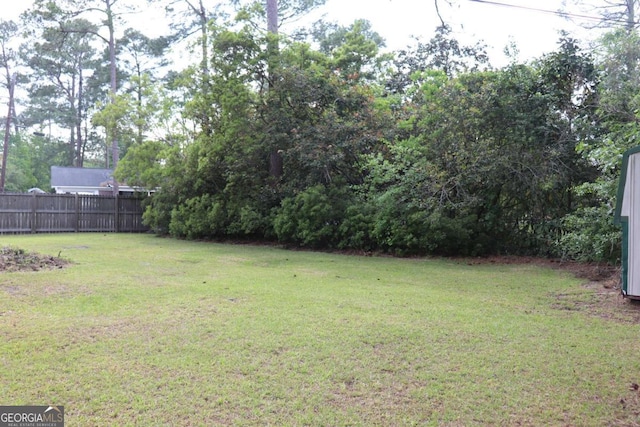 view of yard with fence