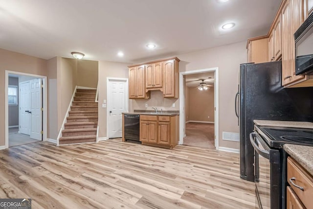 kitchen featuring baseboards, light wood-style flooring, recessed lighting, light brown cabinetry, and black appliances