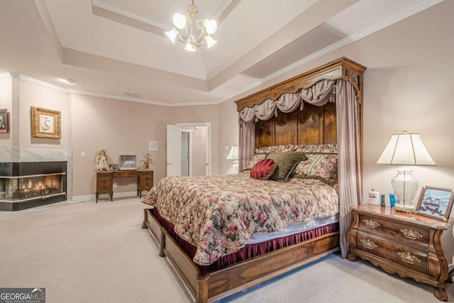 carpeted bedroom featuring a raised ceiling, a fireplace, and crown molding