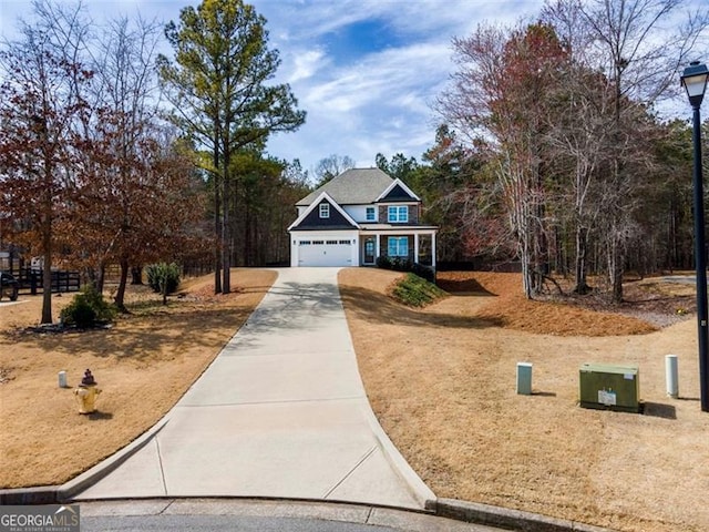 view of front of property with a garage and driveway