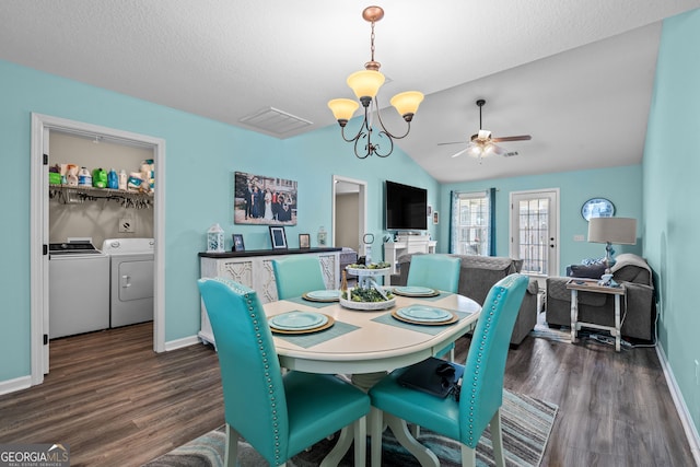 dining room featuring washing machine and clothes dryer, dark wood-style floors, baseboards, and lofted ceiling