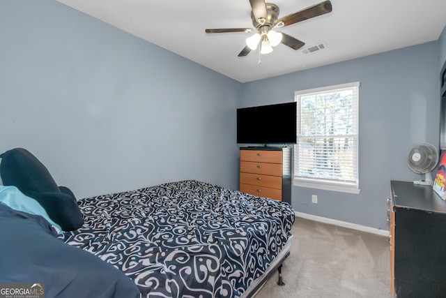 bedroom with carpet flooring, baseboards, visible vents, and ceiling fan