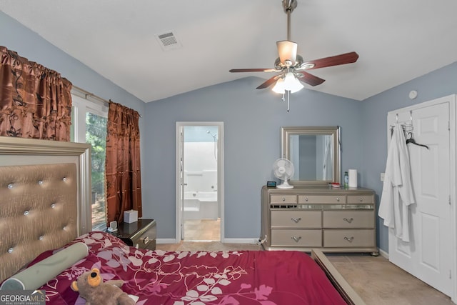 bedroom featuring visible vents, ensuite bathroom, baseboards, ceiling fan, and vaulted ceiling