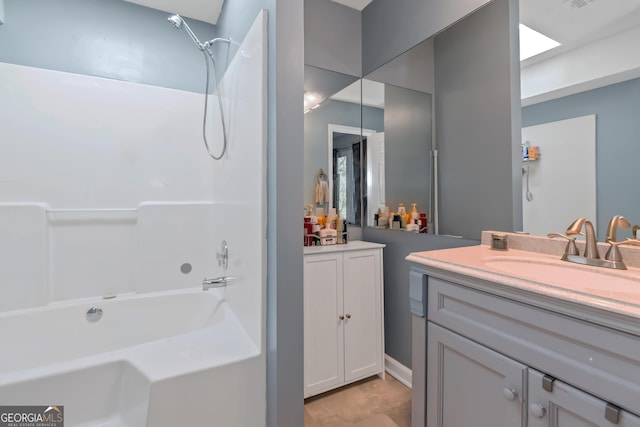 bathroom with vanity and bathtub / shower combination