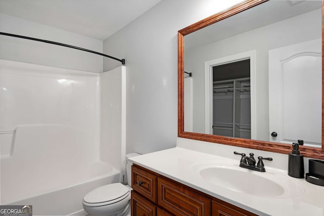 full bath featuring vanity, bathing tub / shower combination, and toilet