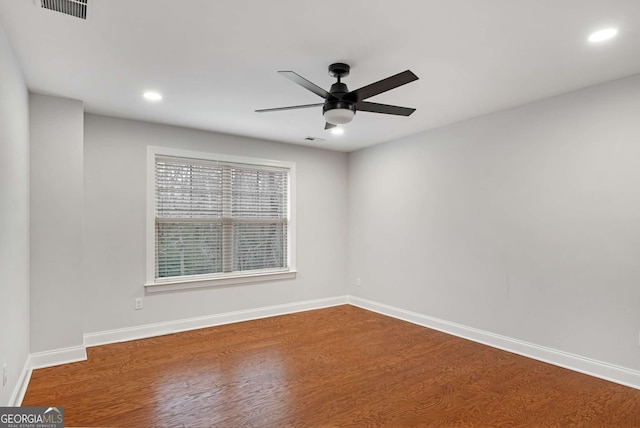 spare room with visible vents, baseboards, recessed lighting, wood finished floors, and a ceiling fan