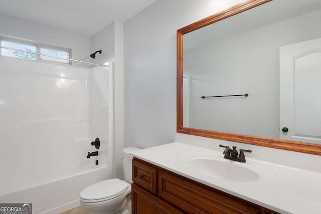 bathroom featuring vanity,  shower combination, and toilet