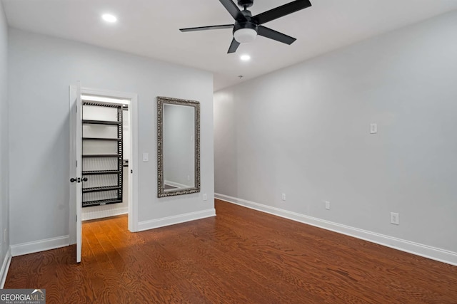 unfurnished bedroom featuring recessed lighting, wood finished floors, and baseboards