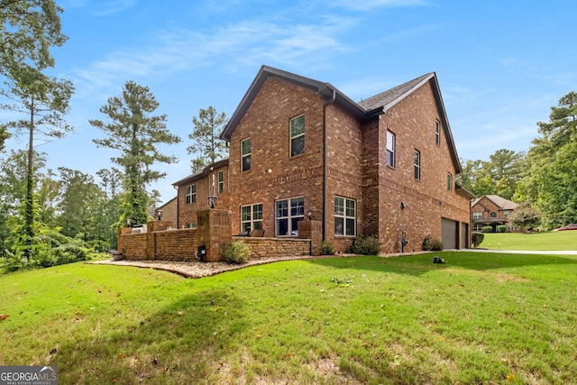 view of home's exterior featuring a yard and brick siding