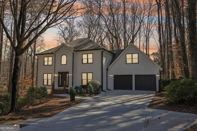 view of front facade featuring concrete driveway