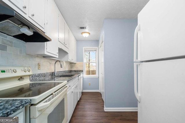 kitchen with white cabinetry, white appliances, under cabinet range hood, and a sink