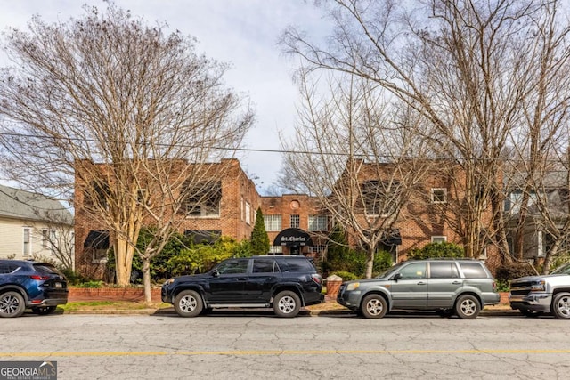 view of property with brick siding