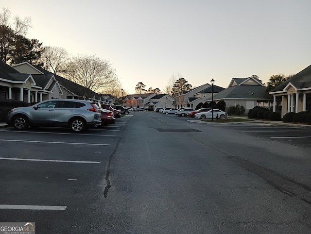 view of street with a residential view and street lights