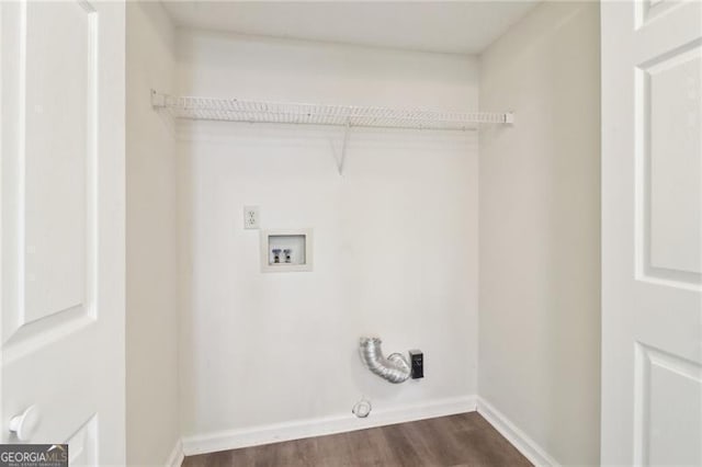 laundry room featuring dark wood-type flooring, washer hookup, hookup for a gas dryer, baseboards, and laundry area