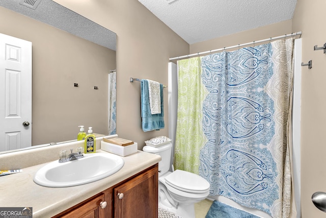 full bathroom featuring vanity, visible vents, a textured ceiling, curtained shower, and toilet