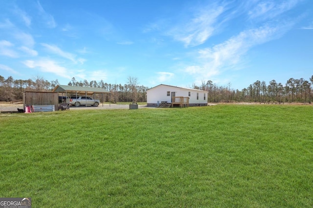 view of yard featuring a detached carport