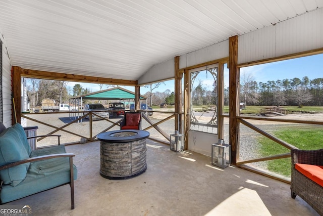 sunroom / solarium featuring lofted ceiling