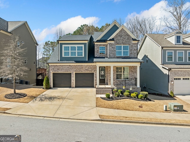 craftsman house with brick siding, a shingled roof, a porch, a garage, and driveway