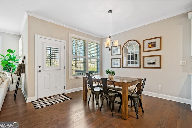 dining room with baseboards, an inviting chandelier, dark wood-style floors, and ornamental molding