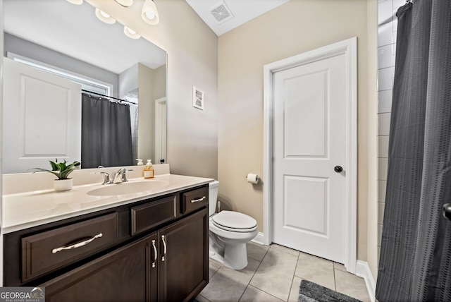 bathroom featuring tile patterned floors, visible vents, toilet, baseboards, and vanity