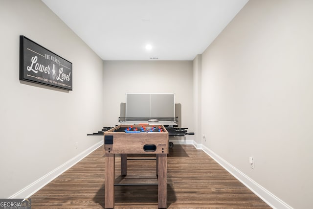 playroom with visible vents, dark wood-type flooring, and baseboards