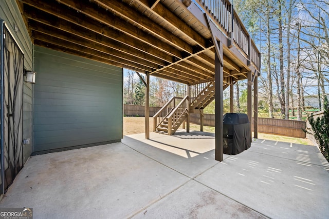 view of patio / terrace with a fenced backyard and stairs