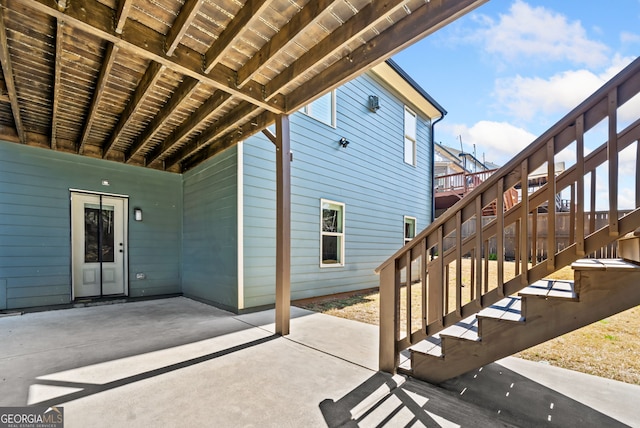 view of patio featuring stairway