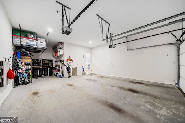 garage featuring a garage door opener