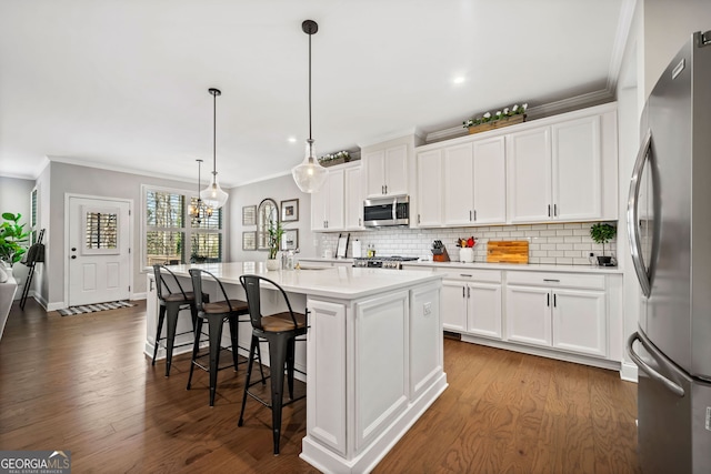 kitchen with stainless steel appliances, tasteful backsplash, and light countertops