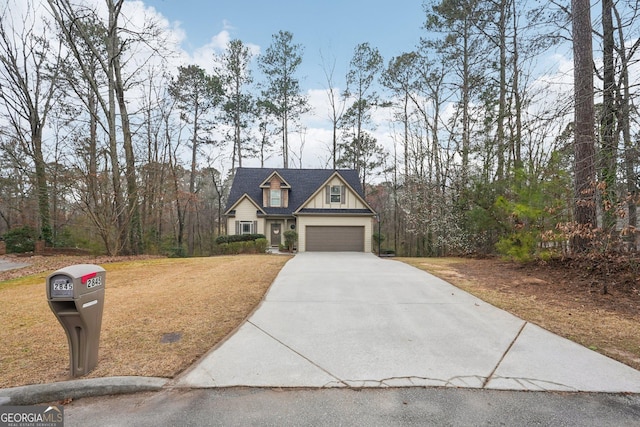 view of front of home featuring a garage, a front lawn, board and batten siding, and driveway