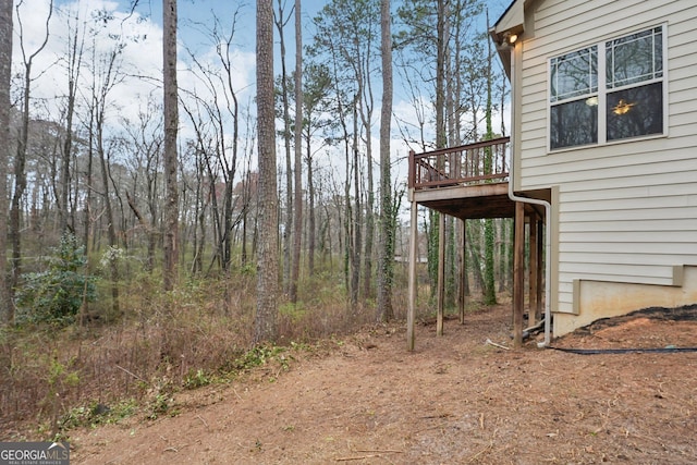 view of yard featuring a wooden deck