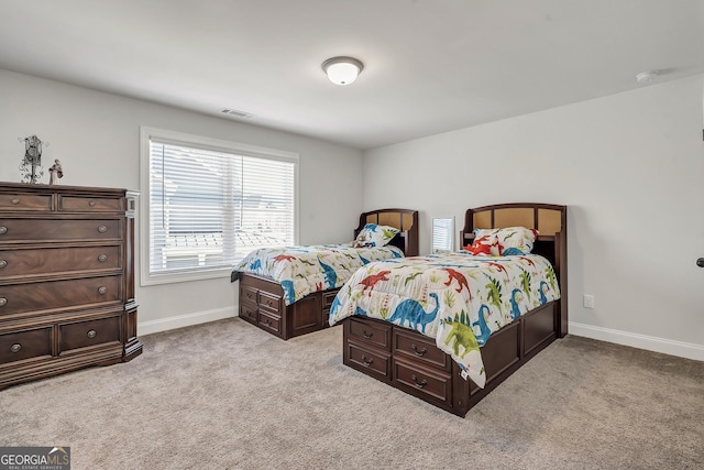 bedroom featuring light carpet, visible vents, and baseboards