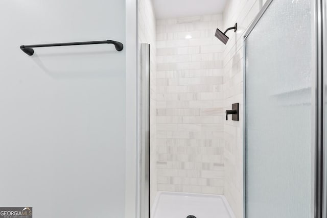 bathroom featuring a shower stall