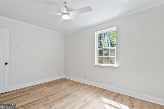 unfurnished room featuring a ceiling fan, light wood-type flooring, baseboards, and ornamental molding