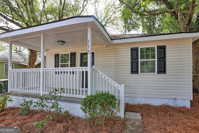 property entrance with covered porch