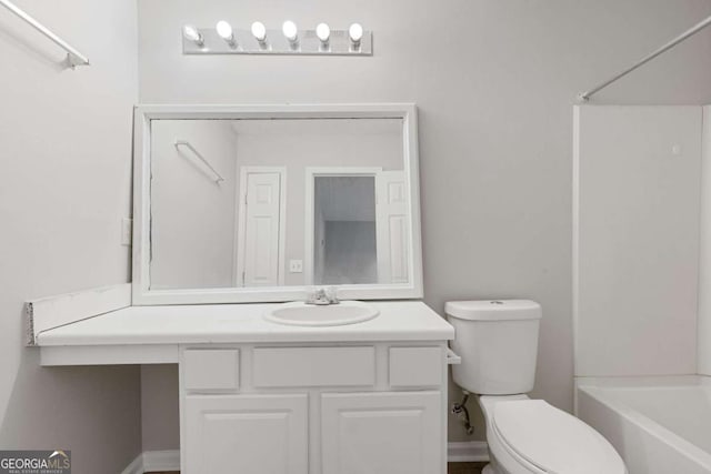 bathroom with toilet, vanity, and shower / bath combination