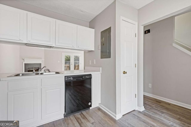bar with baseboards, dishwasher, electric panel, a sink, and light wood finished floors