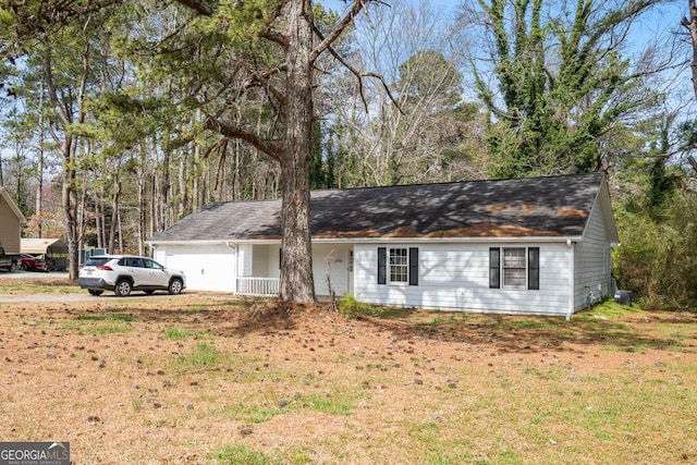 single story home with a front lawn and a garage