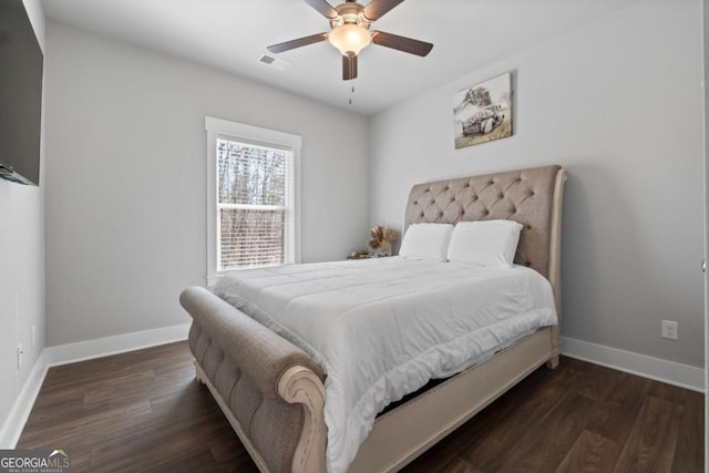 bedroom with visible vents, ceiling fan, baseboards, and wood finished floors