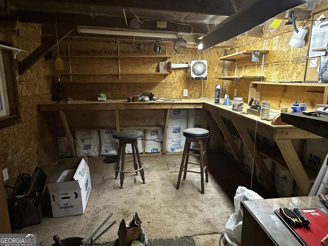 bar with a workshop area and wooden walls