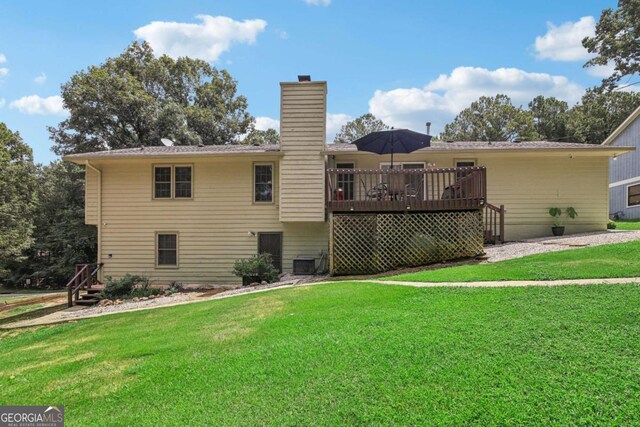 back of house with cooling unit, a lawn, a deck, and a chimney