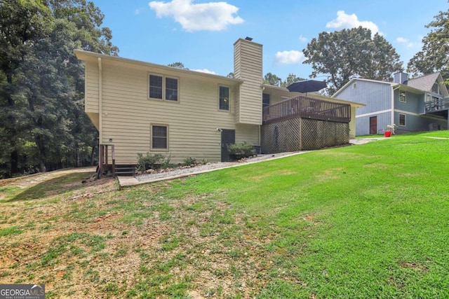 back of property with a lawn and a chimney