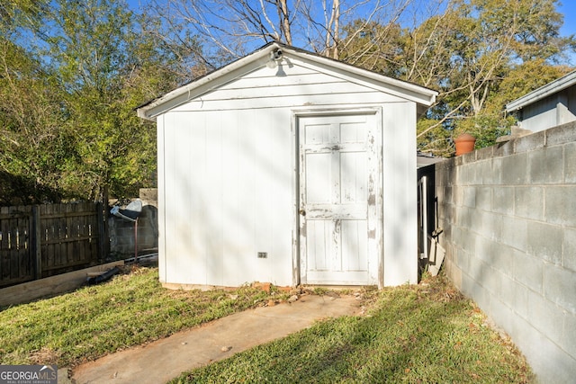 view of shed with a fenced backyard