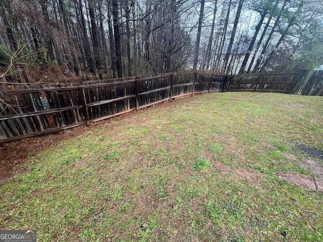 view of yard featuring a fenced backyard