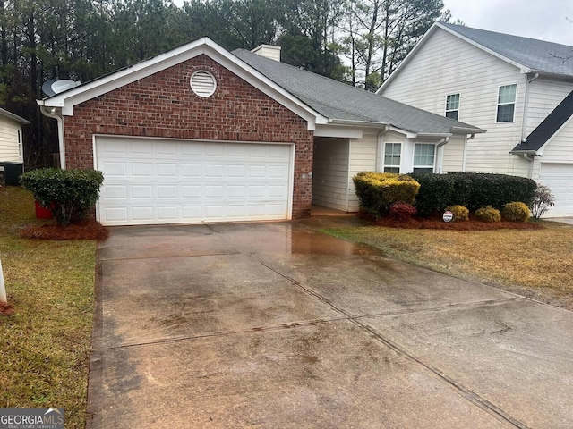 view of front of home with driveway, a shingled roof, a chimney, a garage, and brick siding