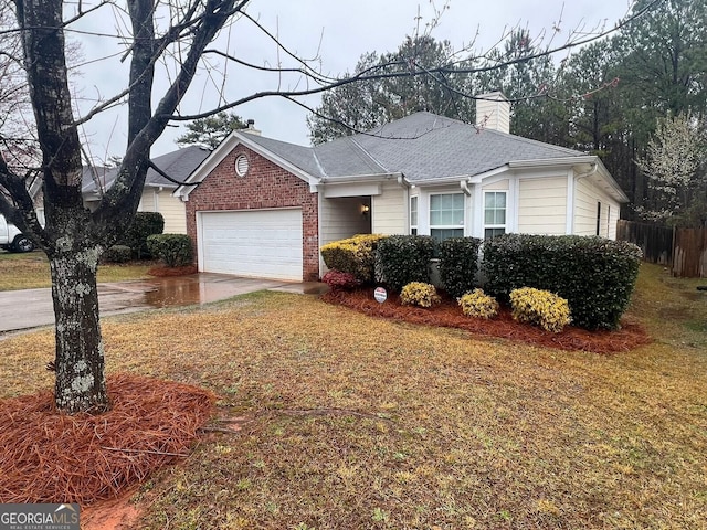 ranch-style house featuring brick siding, an attached garage, a front lawn, a chimney, and driveway