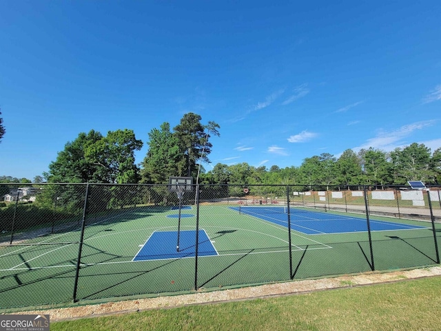 view of sport court featuring community basketball court and fence