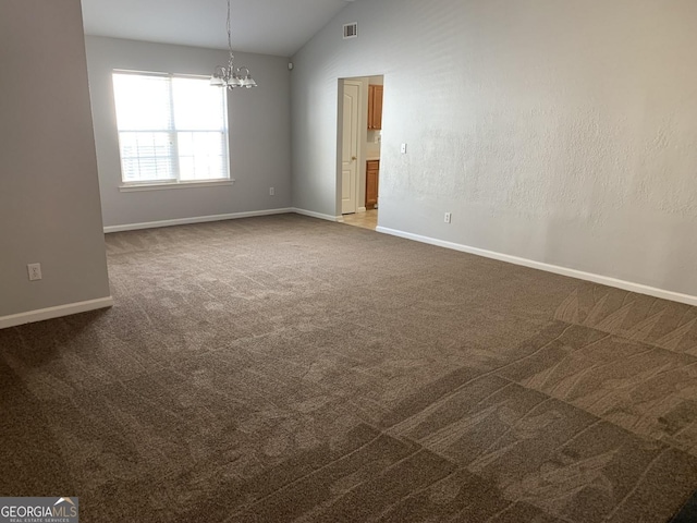 unfurnished room featuring vaulted ceiling, a notable chandelier, baseboards, and dark colored carpet