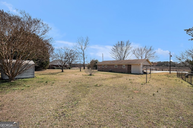 view of yard featuring an attached garage