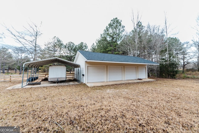 12701 Ga Highway 96 E, Fort Valley, GA 31030 - garage featuring a detached garage and view of scattered trees
